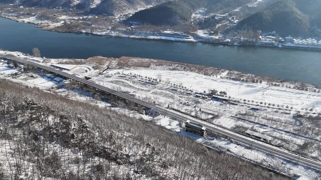 Drone footage, Winter landscape, river, mountain, village in Gapyeon city, South Korea