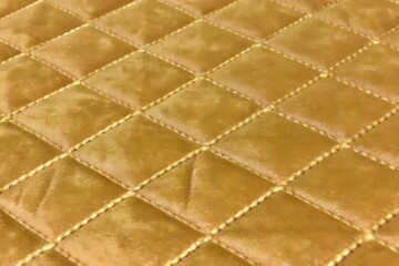 Naklejka premium mustard yellow velvet quilted fabric texture with diamond stitching