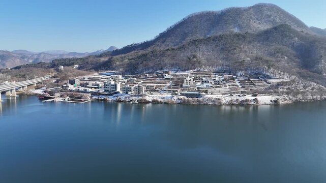 Drone footage, Winter landscape, river, mountain, village in Gapyeon city, South Korea
