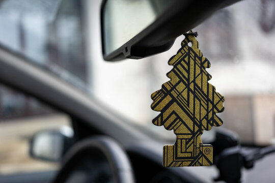 Miercurea Ciuc, Romania- 24 January 2026: Hanging Wunder Baum Gold air freshener on car interior.