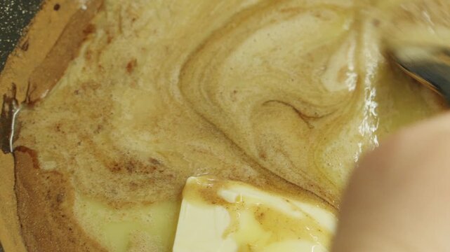 Mixing ingredients in a bowl for a dessert recipe in a kitchen while preparing for a sweet treat