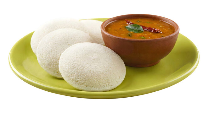Traditional South Indian Idli Served with Spicy Sambar on Green Plate