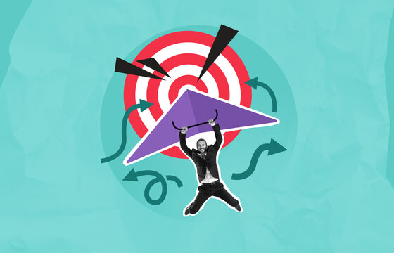 Businessman flying towards target with glider symbolizing goal a