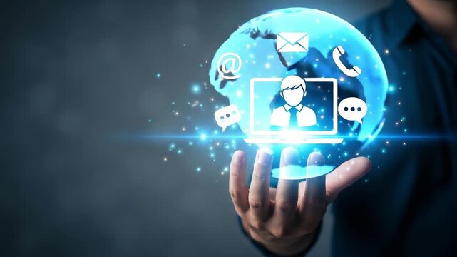 Businessman holds a glowing blue globe with communication icons representing global digital connectivity and online customer service