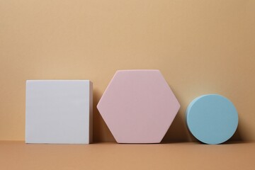 Various podiums with smooth, textured surface under soft tones. Ideal for product mockups, cosmetic displays, or minimal brand presentations. 3D rendering