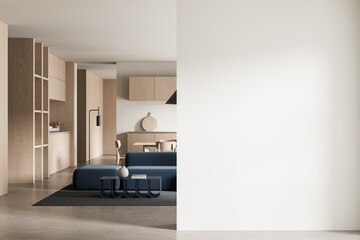 Modern interior with minimal furniture and large blank wall perfect for poster or billboard mockup in clean light-filled room setting. 3D Rendering