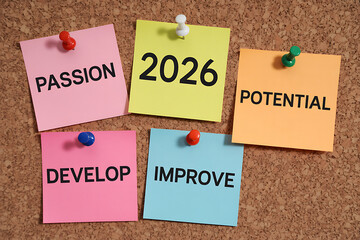 Colorful Sticky Notes on Corkboard Pinning 2026 Goals: Passion, Potential, Develop, Improve for Personal and Professional Growth.
