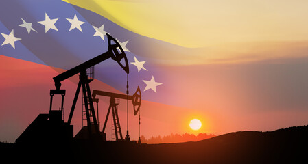 The change in oil prices. Oil price cap concept. Oil drilling derricks at desert oilfield with Venezuela flag. Crude oil production from the ground. Petroleum production.
