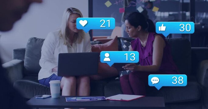 Marketing team reviewing devices monitoring engagement speech spawning engagement icons floating