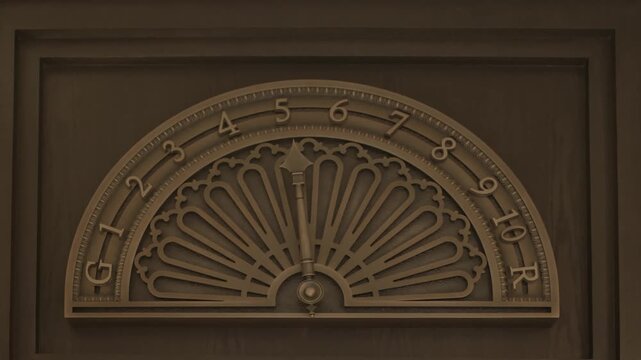 antique lift dial showing floors