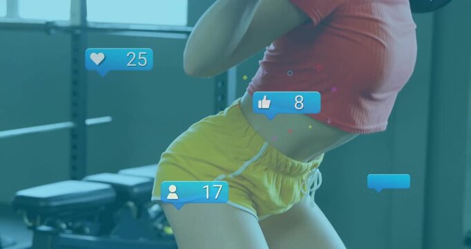 Woman shouldering barbell and squatting for fitness while animated icons tracking engagement counts