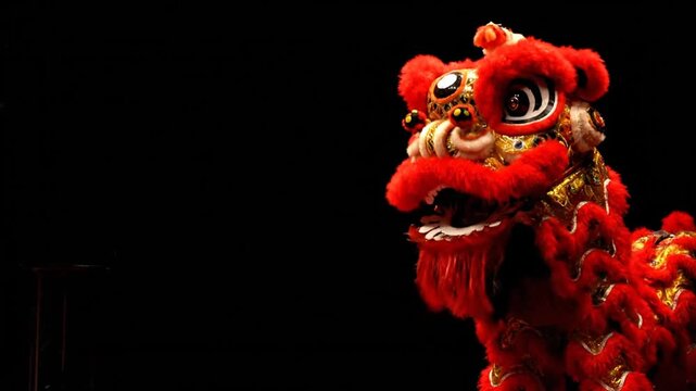 Vibrant Red Chinese Lion Dance Costume Close-Up on Black Background.