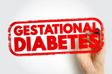 GESTATIONAL DIABETES stamp with hand holding marker, pregnancy health issue concept, medical condition awareness, maternal care