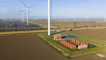 Wind farm generating clean energy with battery storage units