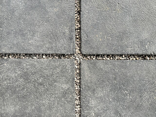 Close up of decorative grey cement concrete slab with pebble dash grouts. Cement concrete in rectangular pattern, suitable for garden footpath outdoor. Seamless background texture. © TMR Studio