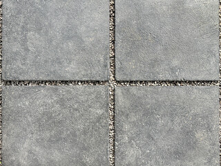 Close up of decorative grey cement concrete slab with pebble dash grouts. Cement concrete in rectangular pattern, suitable for garden footpath outdoor. Seamless background texture. © TMR Studio