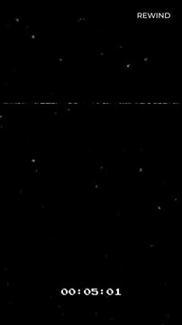 Vertical video rewind vhs retro glitch static media suitable for overlay, transition, background, or nostalgic effects in digital projects.
