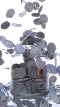 Coins Falling into Glass Jar, Money Savings and Financial Growth Concept
