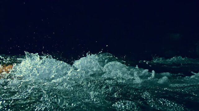 Underwater stones.Slow motion ripple waves on dark water river.Amazing dramatic night cinematic backgrounds.Super slow motion detail 4k video.Epic mystical magic night view.Crystal clear spring river