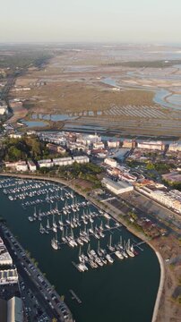 Vertical aerial panoramic view of Ayamonte Marina located at the mouth of the Guadiana River in southern Spain.