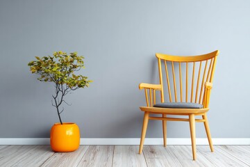 A wooden armchair and a potted tree stand against a gray wall.