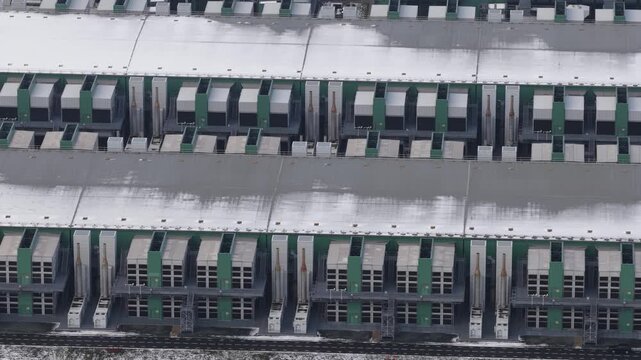 Aerial drone close up views of data center emergency power backup systems and HVAC cooling infrastructure in the Netherlands, highlighting critical energy reliability and climate control for digital o