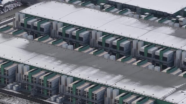 Aerial drone close up views of data center emergency power backup systems and HVAC cooling infrastructure in the Netherlands, highlighting critical energy reliability and climate control for digital o