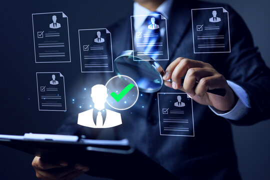 recruitment concept with businessman holding clipboard and using magnifying glass to search for right person from candidate resume applied jobs represents has pass qualified in the position