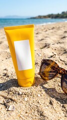 Sunscreen on the beach with sunglasses nearby.