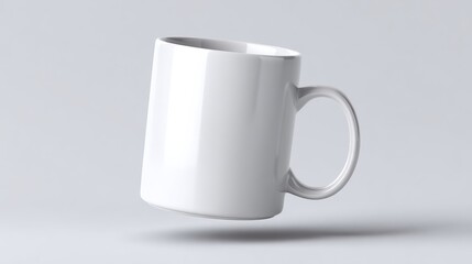 Obraz premium A white coffee cup is shown in a white background. The cup is upside down and he is floating in midair