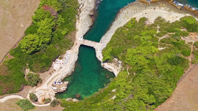 Aerial view of Grotta delle Pupe sea cave in Salento, Puglia, Italy