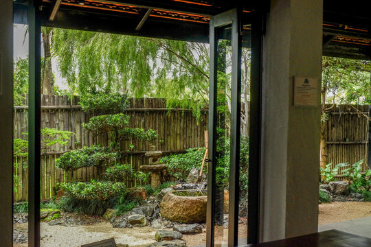 Traditional Japanese house home or ryokan restaurant with sliding paper shoji doors and view natural garden,restaurant or hotel interior.