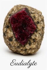 Raw eudialyte crystal in host rock, photographed for mineralogy catalog