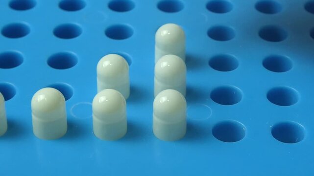 Laboratory technician preparing vaginal suppositories in a mold