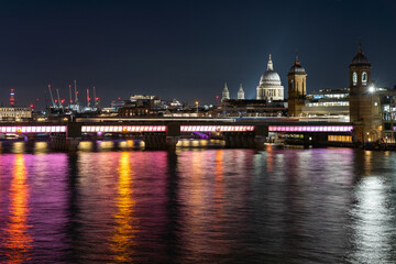 Fototapeta premium Night cityscape with illuminated bridge