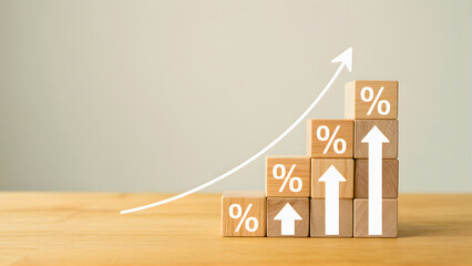 Wooden blocks stacked in a stair-like formation with percentage symbols and an upward trending arrow, symbolizing financial growth and increasing profits
