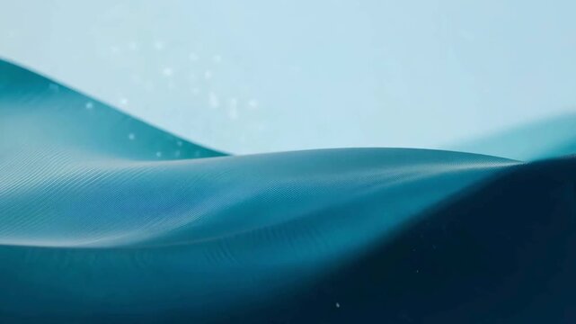 Smooth turquoise blue surface waving softly like silk fabric or desert sand dunes in a clean 3D loop.