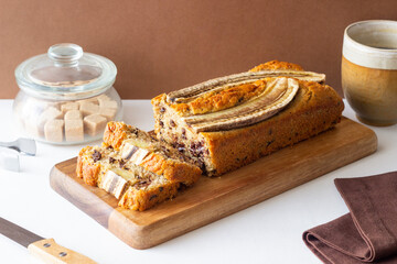 Banana bread with chocolate. Homemade. Vegetarian food. American cuisine.