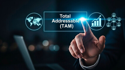 Fototapeta premium A business person analyzing market potential with Total Addressable Market concept