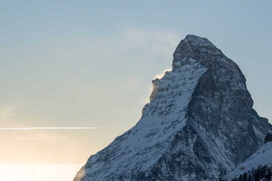 Winter alpine landscape with the Matterhorn peak in Switzerland, showing snow covered mountains and terrain near the Zermatt ski area.