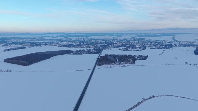 Svitavy city in winter from above, snowy houses and panorama.
Drone landscape view of frozen town scenery.