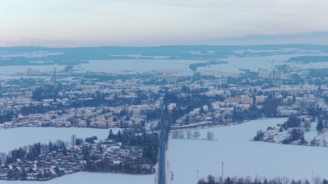Winter aerial view of Svitavy city with snow-covered houses.
Panoramic drone shot capturing quiet urban landscape in winter.