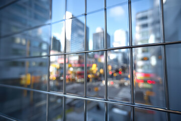 Obraz premium Soft blurred city reflection behind window grid, abstract urban geometry with calm mood