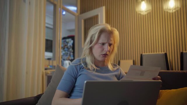 Stressed worried young woman feels panic about financial problem checking household payments. Frustrated female renter calculating bills, bank mortgage debt looking desperate about bankruptcy at home