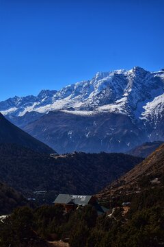 Tyangboche Monastery with Himalayan mountains, Nepal, vertical landscape
