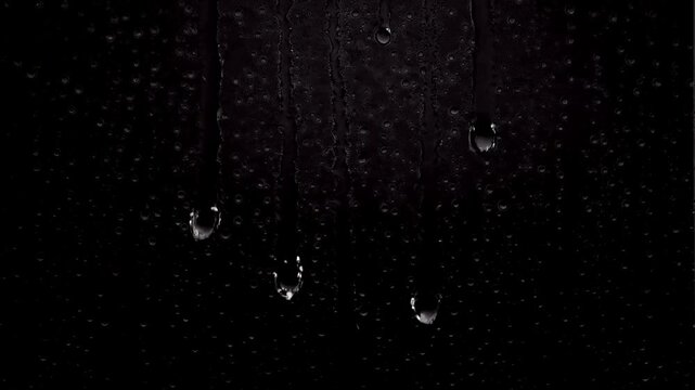 Realistic heavy rain droplets and streaks running down a transparent surface with a clean alpha channel, optimized for atmospheric overlay effects simulating intense weather conditions.