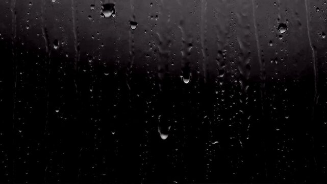High contrast close-up of heavy rain droplets running down a dark, textured window pane, designed as an isolated cinematic overlay asset with a built-in alpha channel for professional video compositin