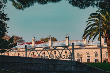 Historic stone building surrounded by autumn trees in Istanbul garden