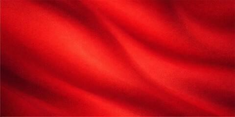 Obraz premium Smooth flowing red silk and satin fabric creates a luxury textile background with a shiny wave texture and romantic drapery for a soft velvet valentine backdrop