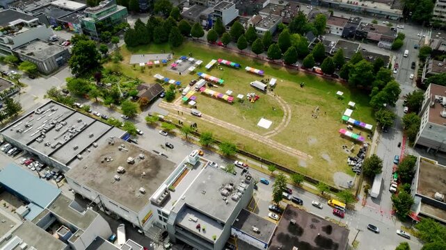 Tents During Annual Festivals At Jonathan Rogers Park In Vancouver, British Columbia, Canada. Aerial Drone Shot